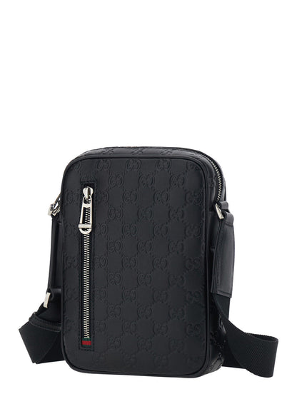 Gucci Men 'Emblem' Black Crossbody Bag With Adjustable Shoulder Strap And All-Over Embossed Gg Motif In Leather Man