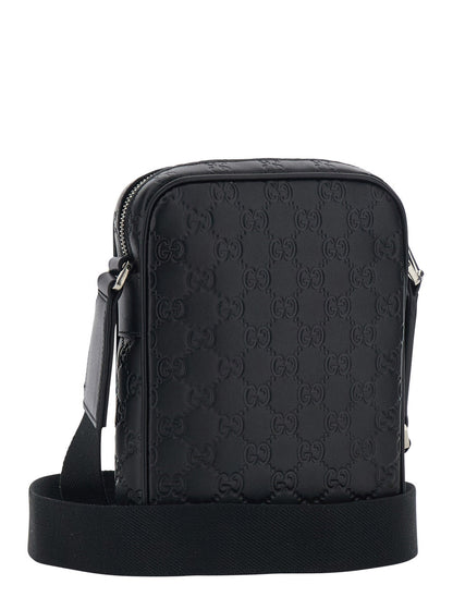 Gucci Men 'Emblem' Black Crossbody Bag With Adjustable Shoulder Strap And All-Over Embossed Gg Motif In Leather Man