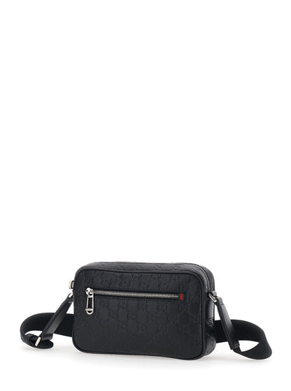 Gucci Men 'Emblem' Black Crossbody Bag With Adjustable Shoulder Strap And All-Over Embossed Gg Motif In Leather Man