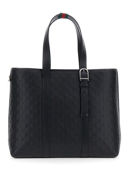 Gucci Men 'Emblem' Black Tote Bag With All-Over Embossed Gg Motif In Leather Man